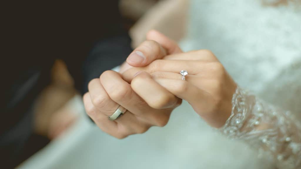 Husband and wife holding hands