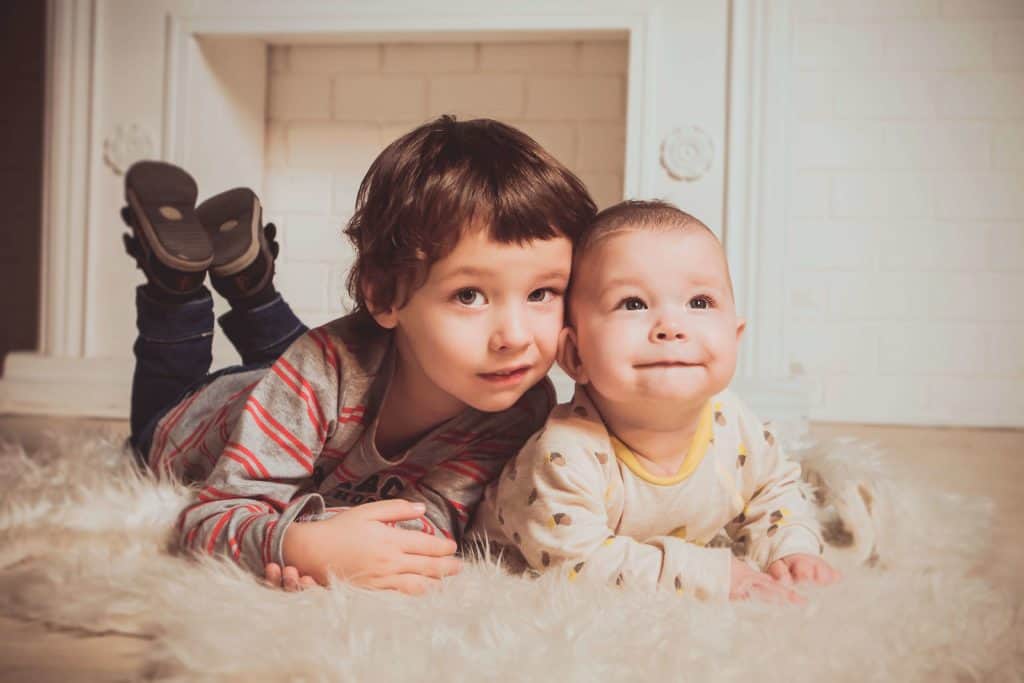 Picture of toddler and baby to show the SLED hypothesis that both are human