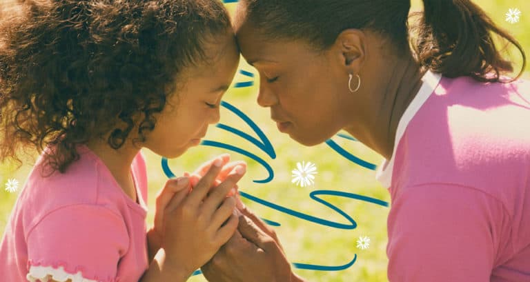 Mother praying for her daughter.