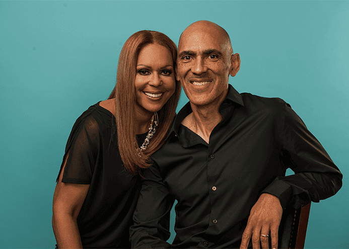 A photo of Tony and Lauren Dungy smiling and facing the camera. They share share tips for building great teamwork in marriage.