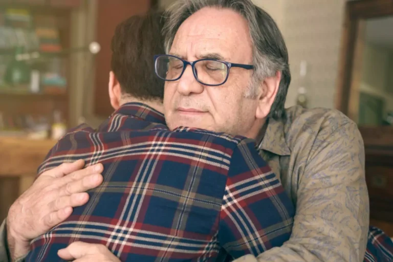 Father hugging his adult son, who is deconstructing his Christian faith