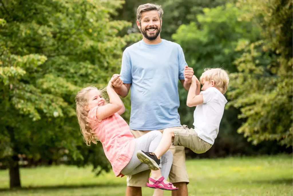 Father with two children playing and loving a teachable moment